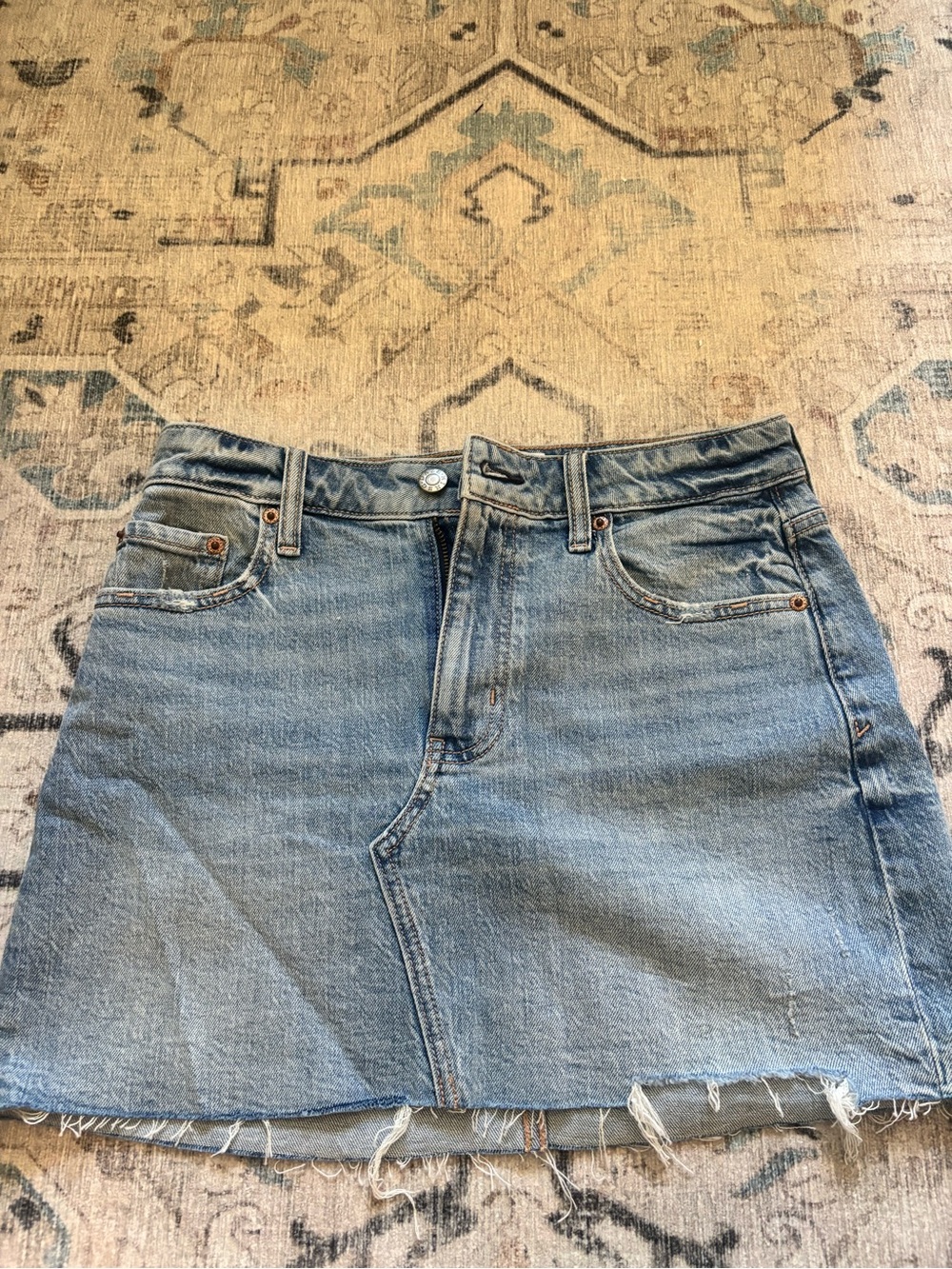 Light Blue Denim Mini Skirt with Frayed Hem